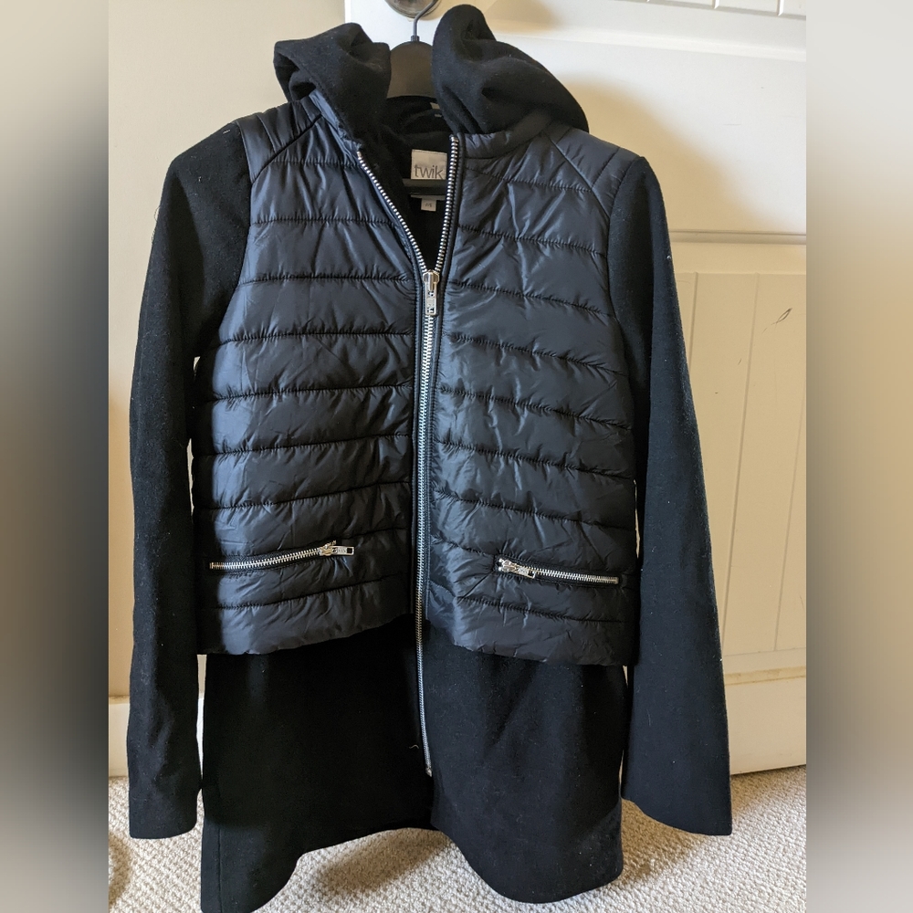 Twik black long jacket with quilted puffer vest detail